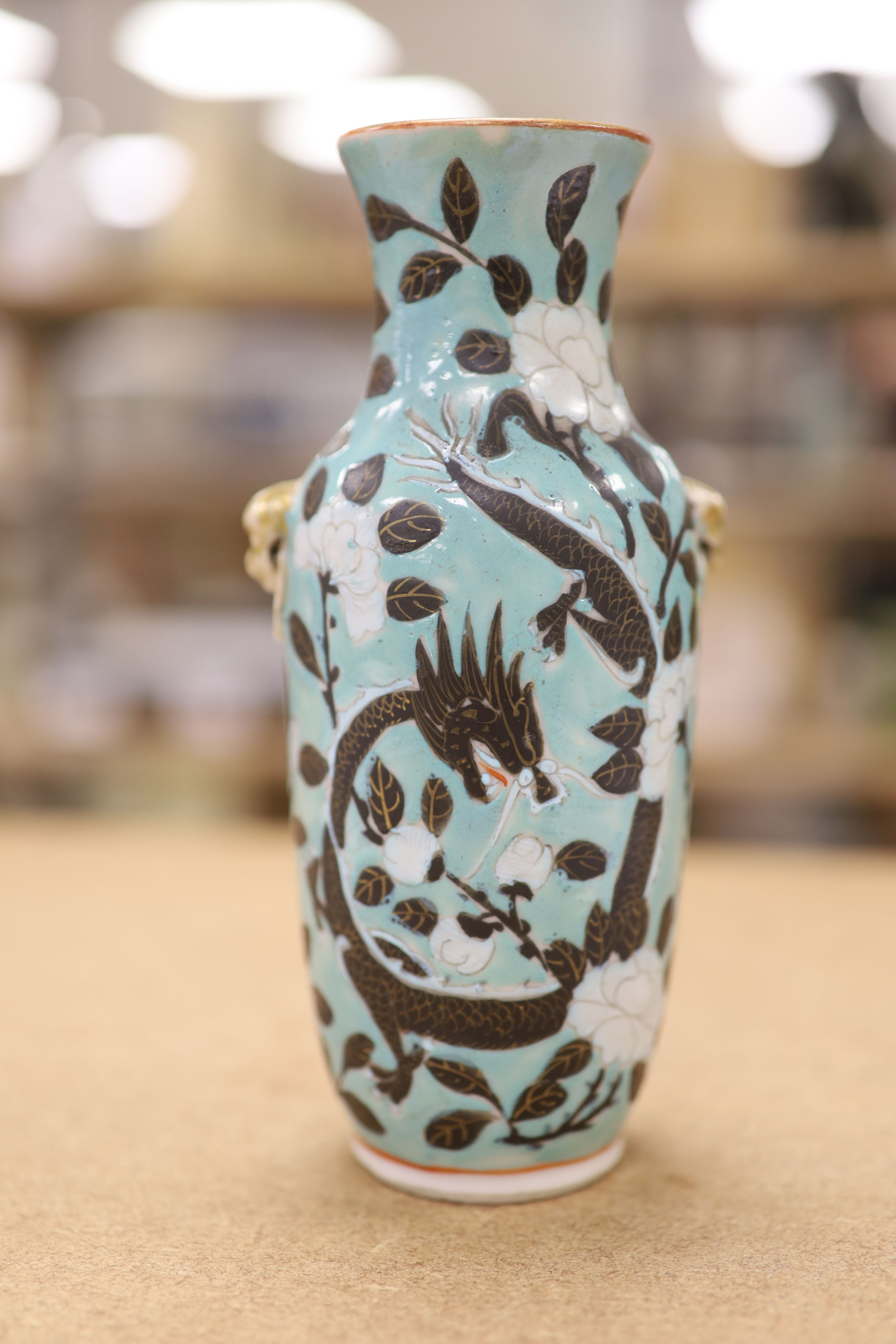 A Chinese turquoise glazed 'dragon' vase, c.1900, height 18cm